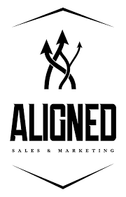 Logo of Aligned Sales & Marketing featuring the word 'ALIGNED' in bold black letters with arrows symbolizing direction and alignment.