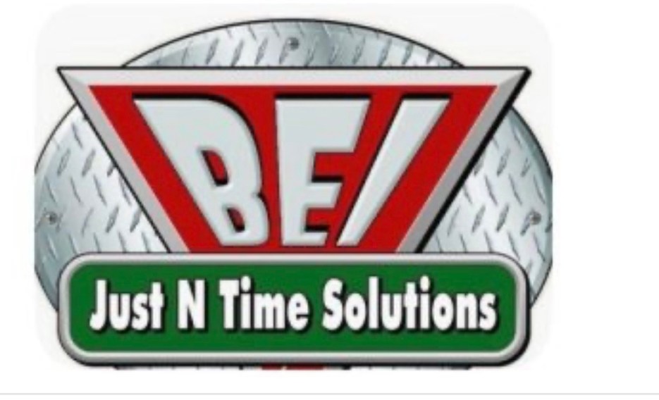 Logo for BEI Just N Time Solutions featuring a bold red design with a green banner and aluminum diamond plate background.