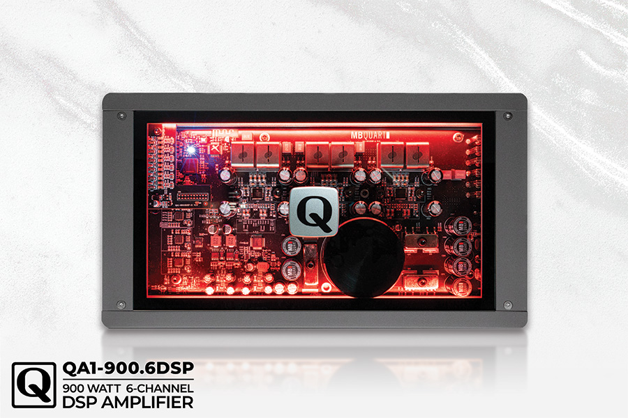 Close-up view of a QA1-900.6DSP 900 watt 6-channel digital signal processor amplifier with illuminated circuitry.