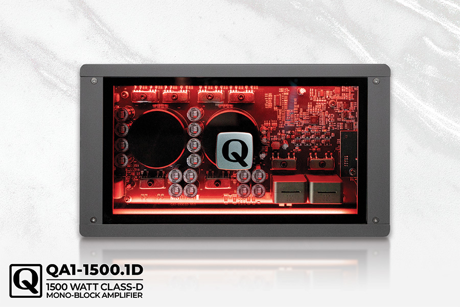 Close-up view of a QA1-1500.1D 1500 watt class-D mono-block amplifier with illuminated circuitry and components.