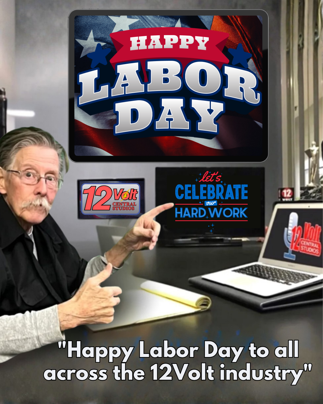 A man with glasses and a mustache pointing at a computer screen displaying a 'Happy Labor Day' message, alongside the logo of 12 Volt Central Studios, with a note celebrating hard work in the 12 Volt industry.